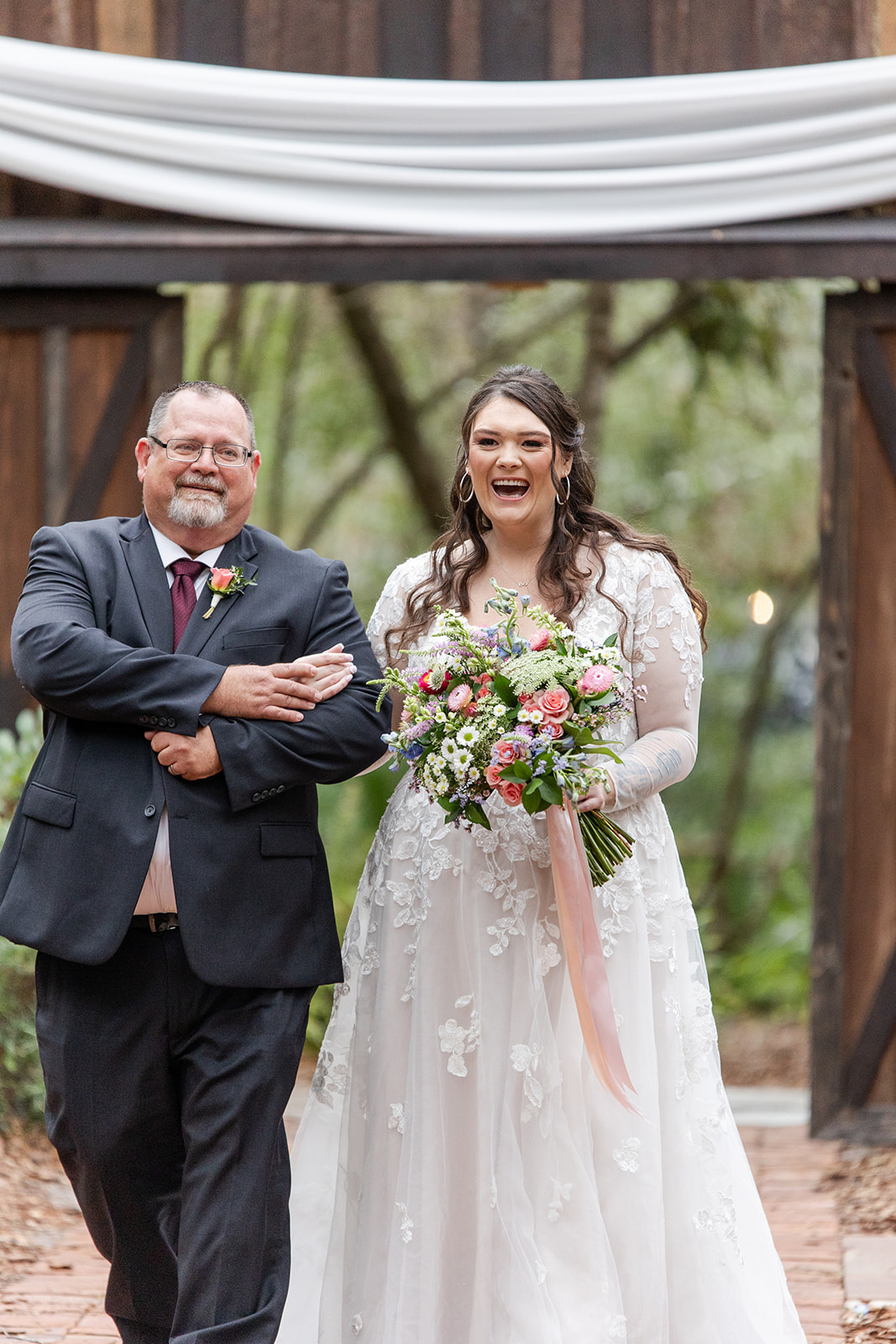 Bride walking with her father