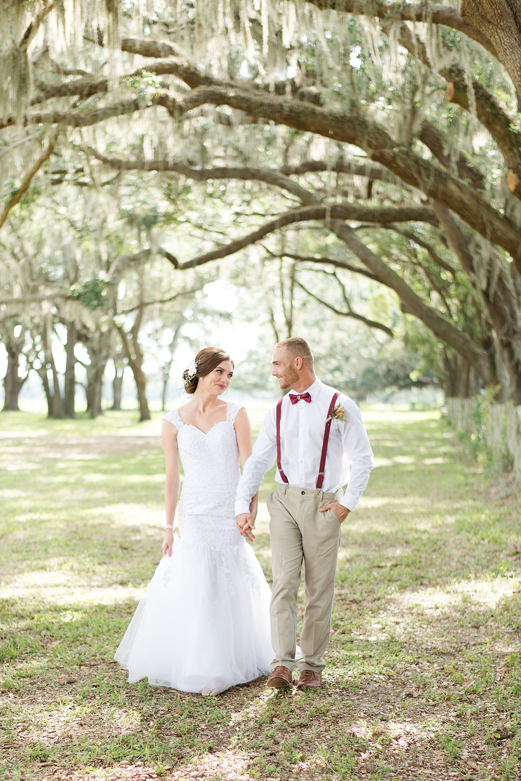 Couple walking under trees