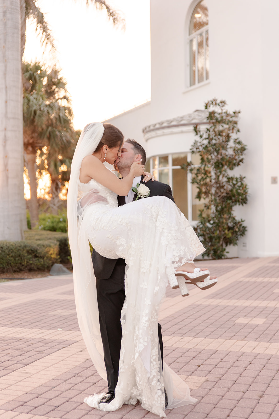 Groom carrying bride