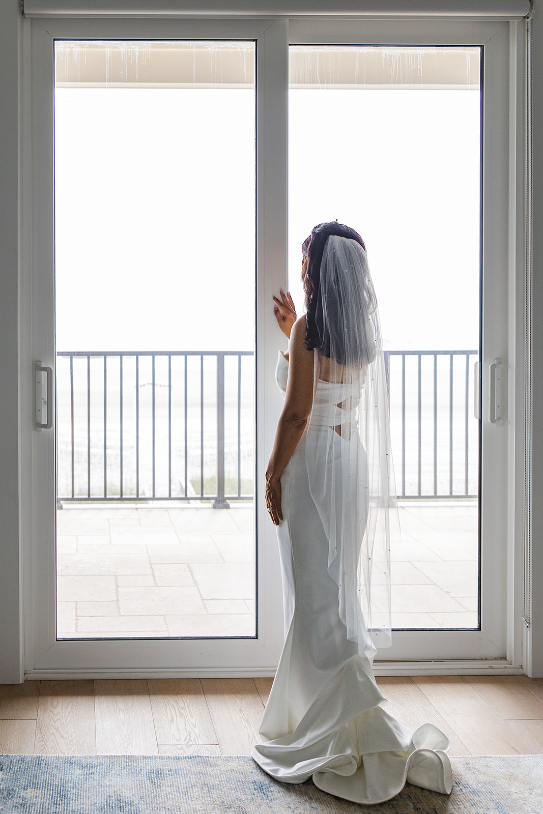 Bride at balcony window